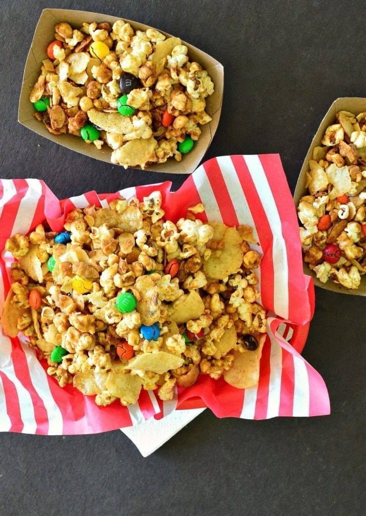 Popcorn with a chipotle caramel glaze and potato chips and almonds and m and m's! #caramelcorn #snackfood #popcorn www.thisishowicook.com
