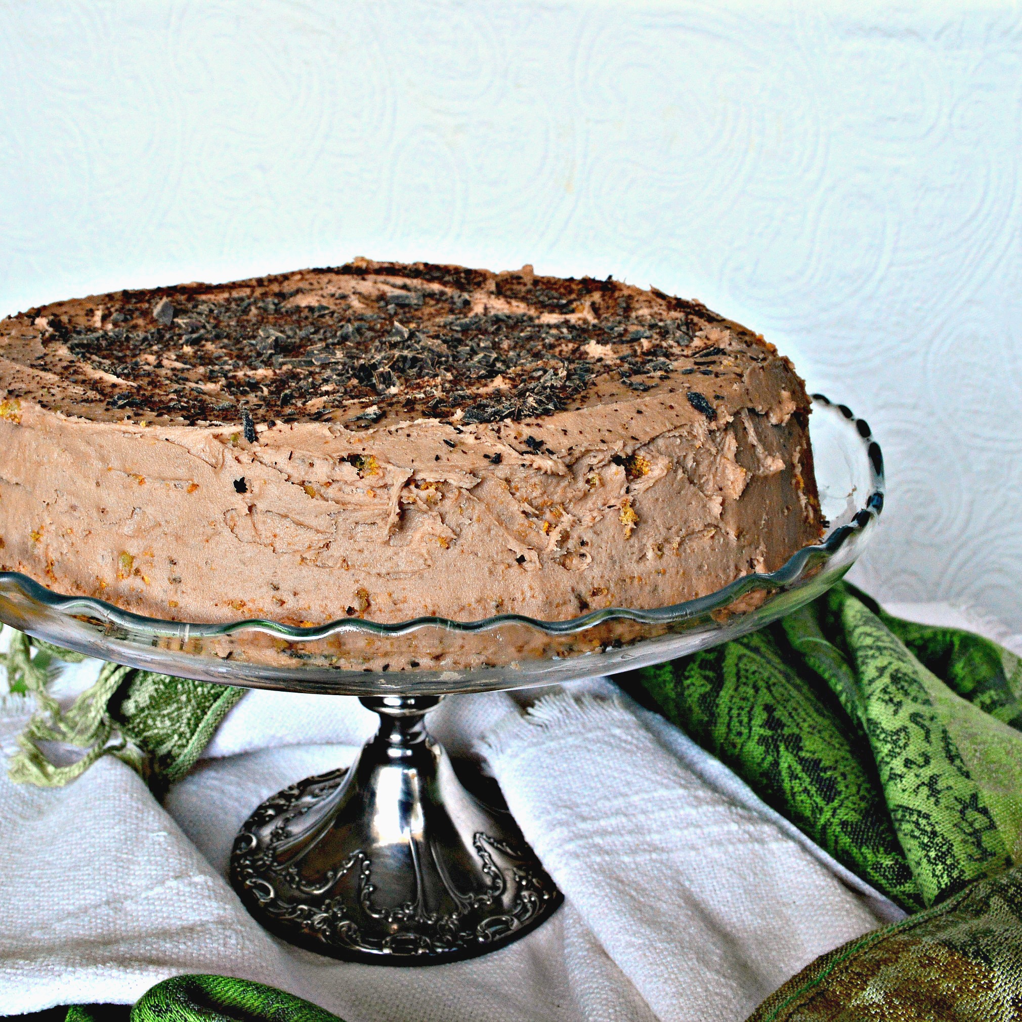 passover cake recipe for Ilse's Mocha nut cake on glass cake platter with green napkin