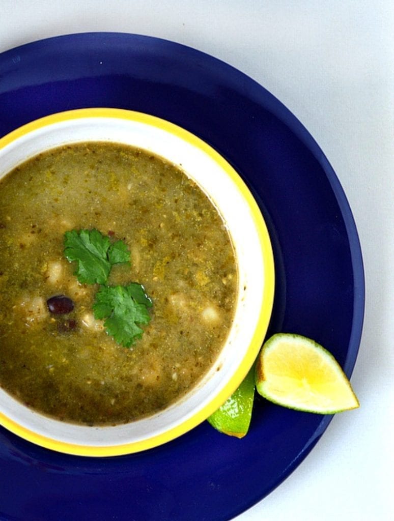 This green posole is made with fresh green herbs and black beans, tomatillos and chiles. It is great! #posole #Mexicanfood #soup www.thisishowicook.com