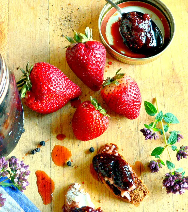 Black Pepper Strawberry jam with a spoonful of jam and fresh strawberries