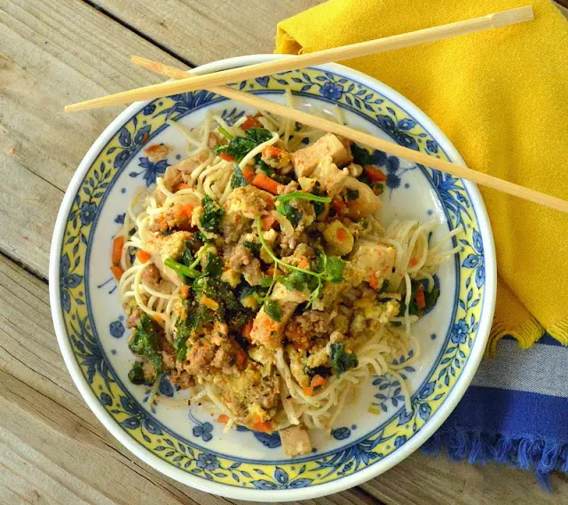 This simple Japanese stir fry Donburi bowl with ground meat and tofu and a scrambled egg is pure comfort food. Quickly made, it can be served over rice or noodles and tastes way better that going out for Japanese fast food! #JapaneseFood #AsianFood #donburi #RiceBowl #NoodleBowl www.thisishowicook.com