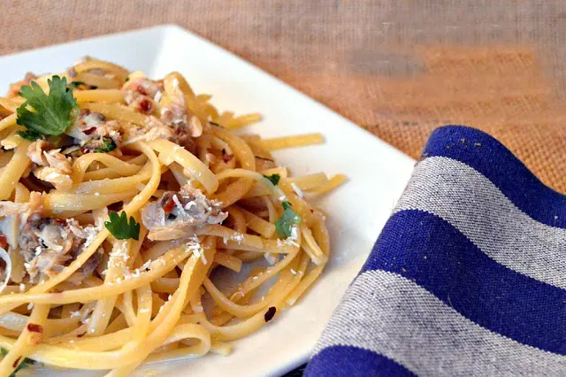 IMO, this linguini with clam sauce is the best way to eat clams! Made the traditional Italian way, you will be amazed at how good it is and how simple to make! #pasta #Italianfood #clams www.thisishowicook.com