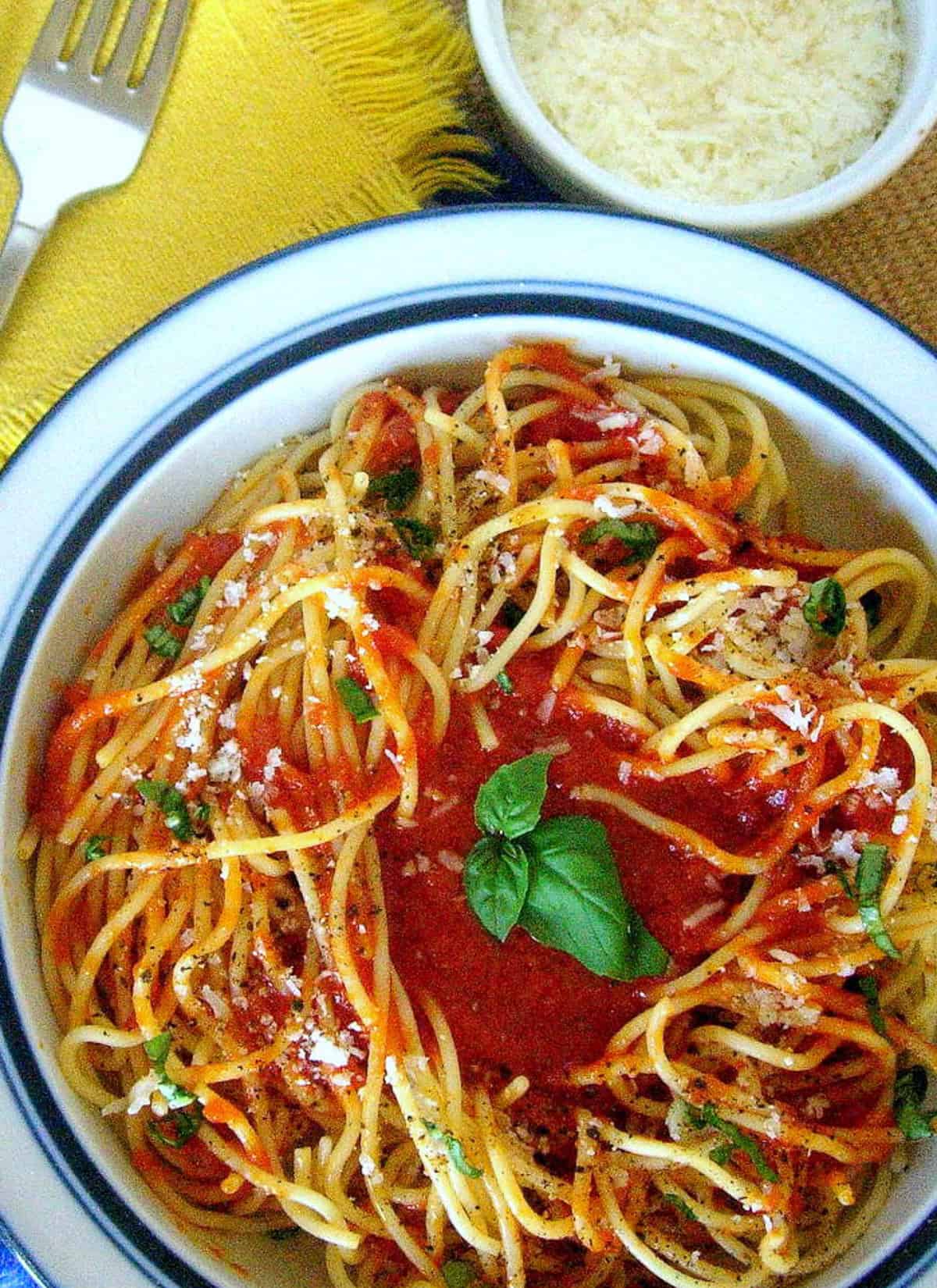 marcella hazan's tomato butter sauce in blue rimmed bowl