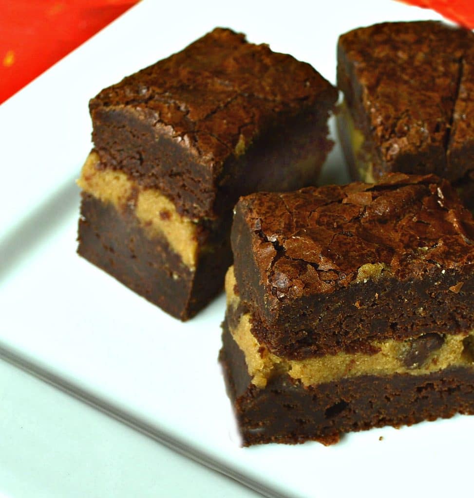 Chocolate Fudge Brownies filled with cookie dough are perfect for the days you can't decide. Rich and luscious, these are the real thing! #brownies #cookiedough #baking #recipes #cookiebars For more great recipes go to: www.thisishowicook.com