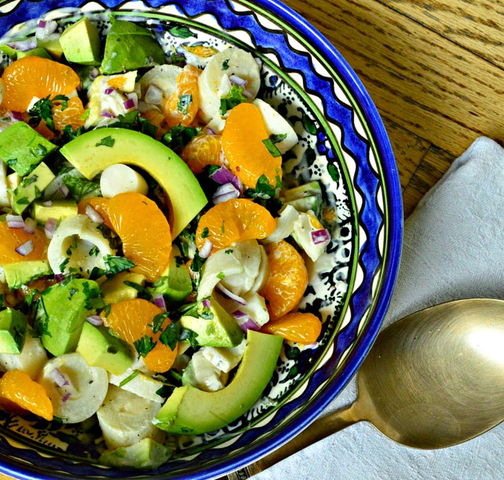 Hearts of Palm, Avocado and Orange Salad is divine! As easy as opening a can of of Mandarin oranges and some hearts of palm, slice an avocado and make a very simple dressing; well this is a salad that people ask for more! #salads #hearts of palm #mandarinoranges www.thisishowicook.com