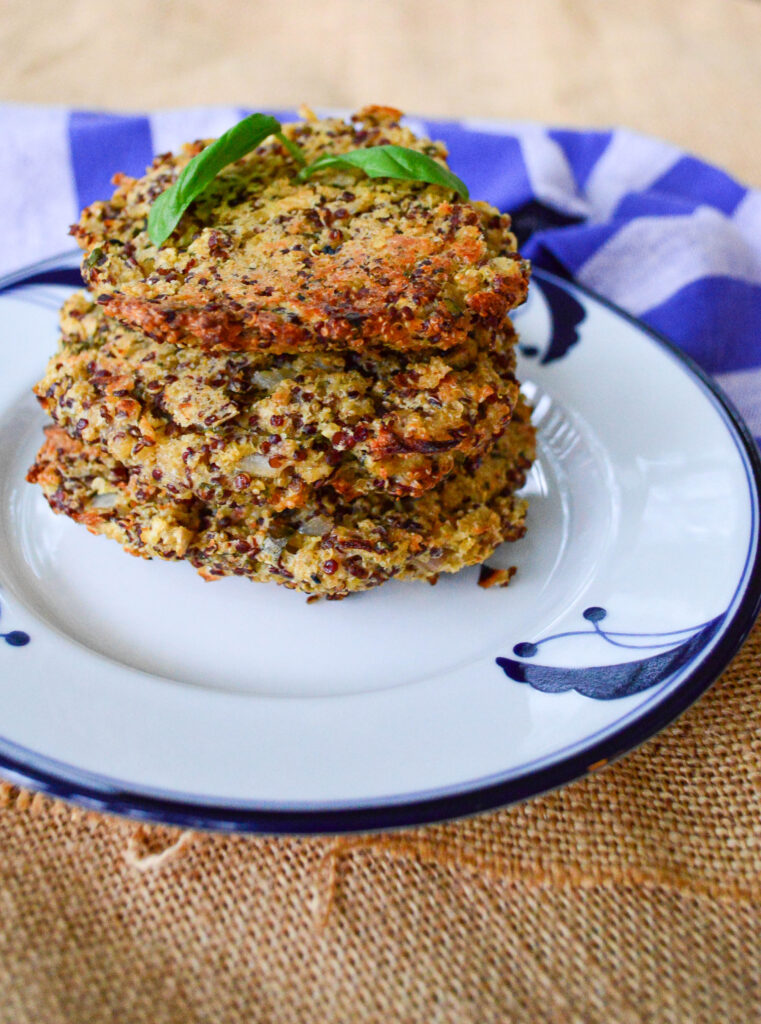 quinoa cakes on blue and white plate