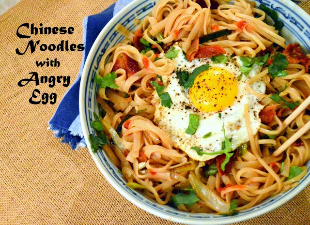chinese noodle bowl with fried egg