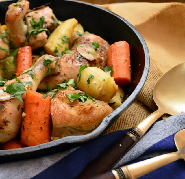 chicken and vegetables in cast iron skillet