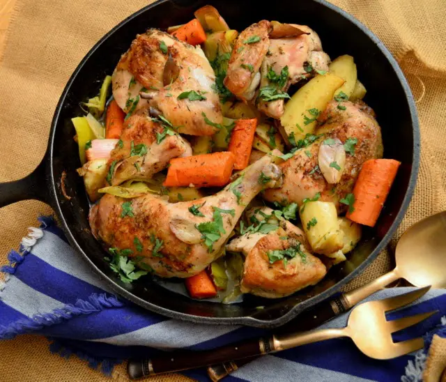 chicken and vegetables in cast iron skillet