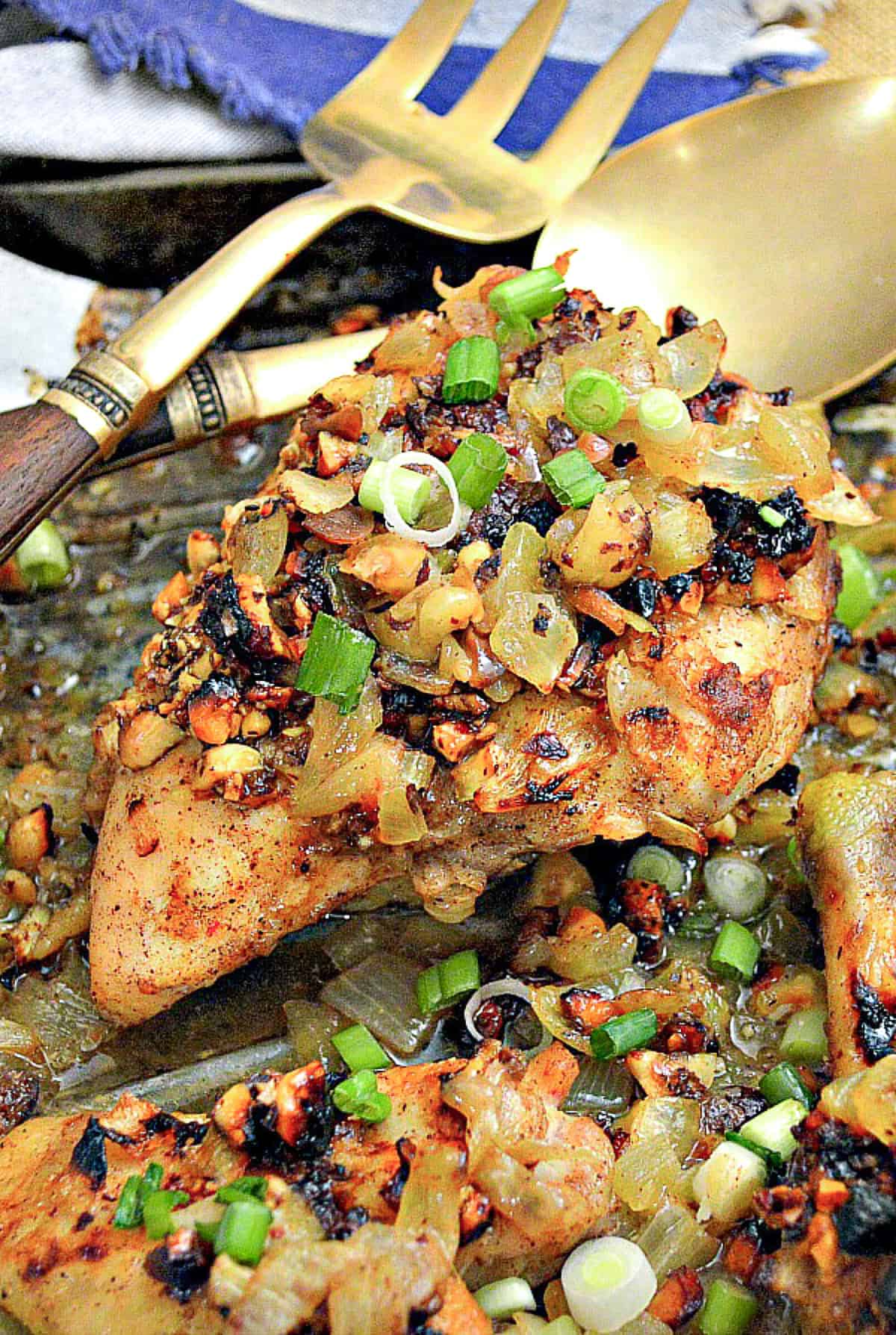 ottolenghi roast chicken with saffron, hazelnuts and honey on baking sheet 