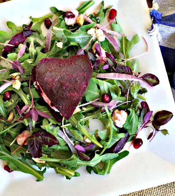 Baby Lettuce Salad with a Beet heart filled with goat cheese.
