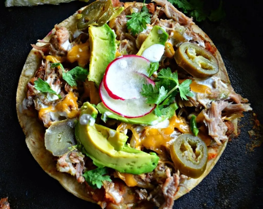 Carnitas are braised pork and in this case with lime and jalapenos. Cook and shred and use this on everything. My man loves it! #carnitas #Mexicanfood #tacos #pork www.thisishowicook.com