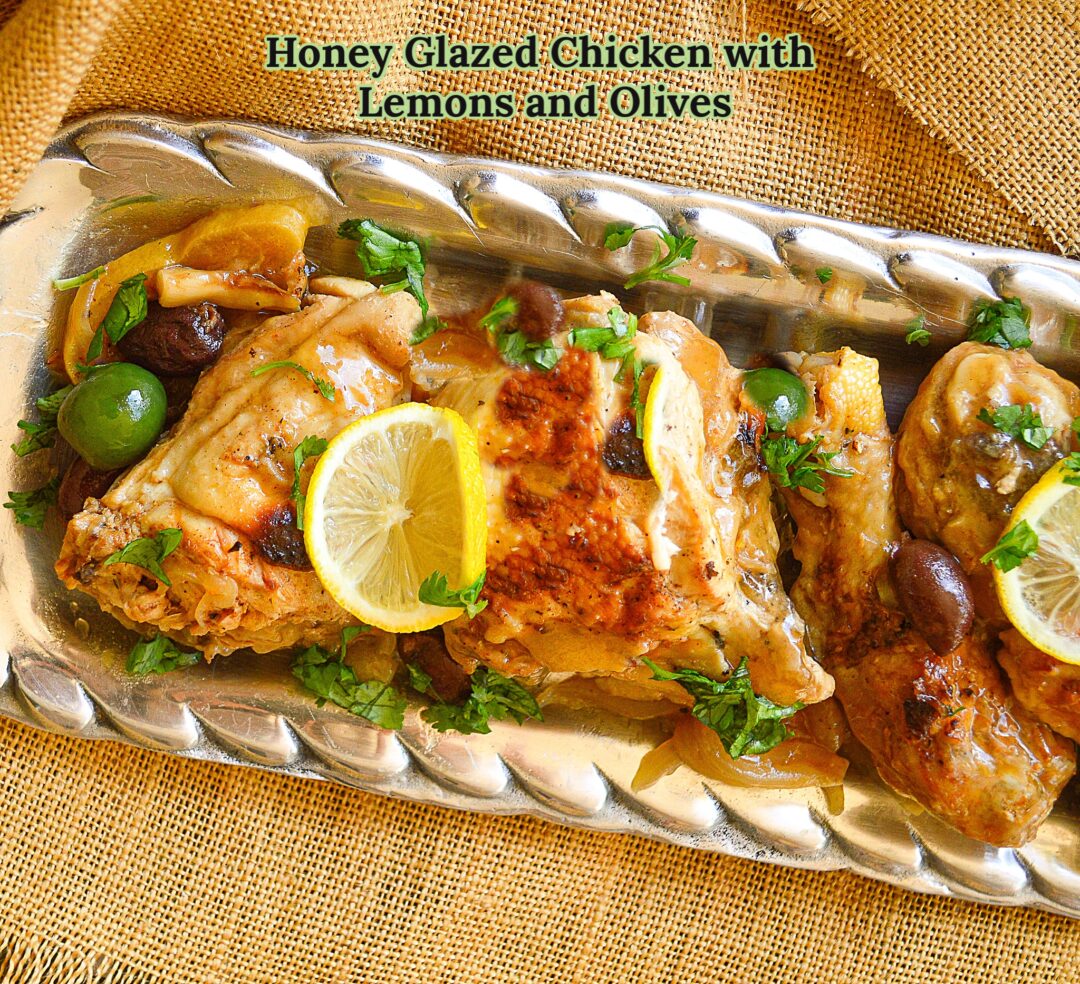 chicken cooked with lemons, olives and onions  is browned on the