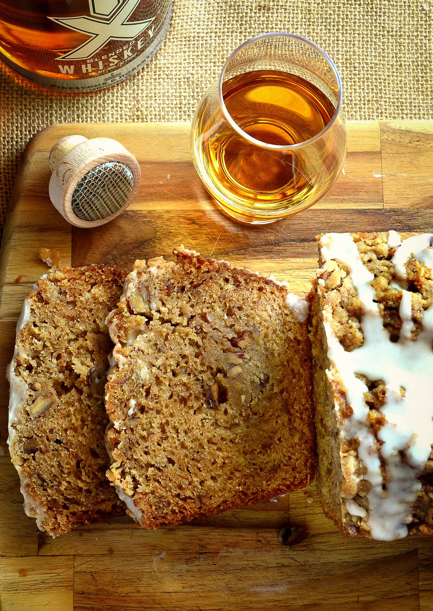 tx whiskey honey cake  sliced with glass of whiskey