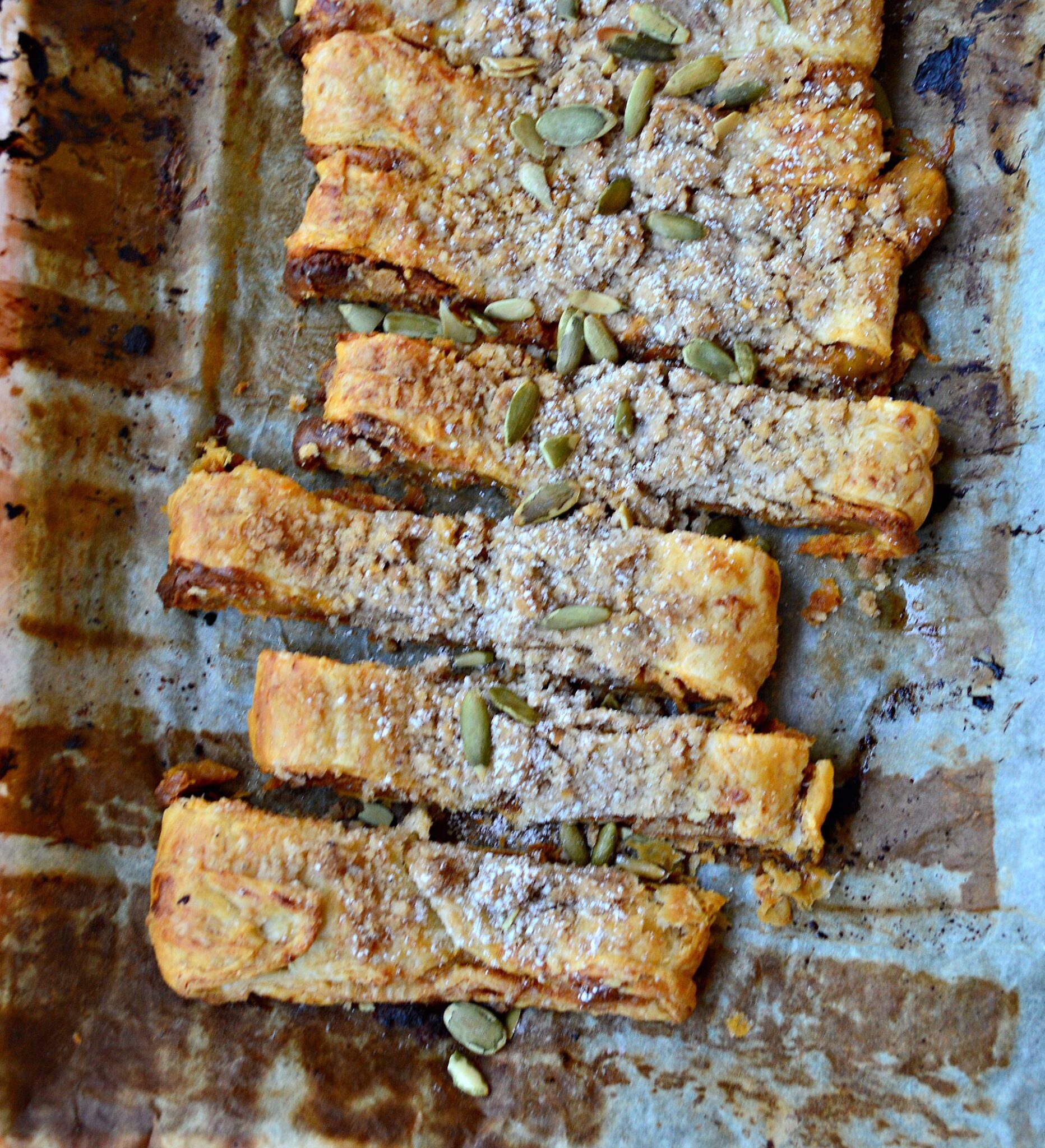 pumpkin puff pastry kringle on baking sheet