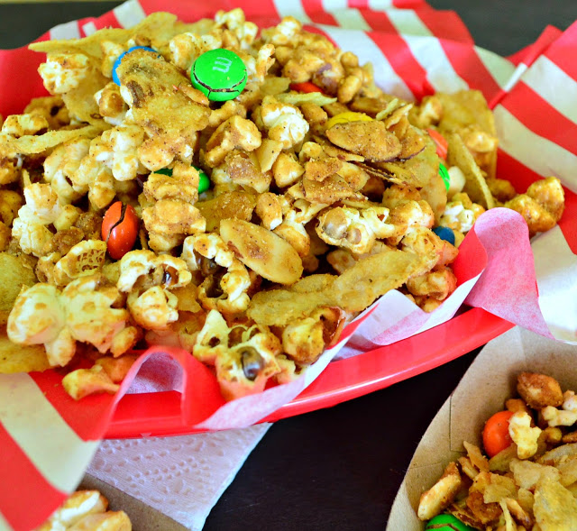 Popcorn with a chipotle caramel glaze and potato chips and almonds and m and m's! #caramelcorn #snackfood #popcorn www.thisishowicook.com