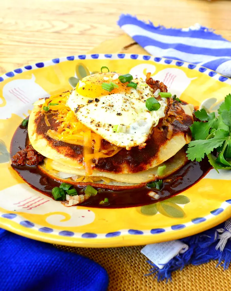 Breakfast enchiladas with red chile