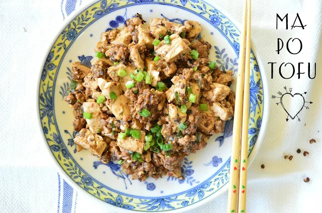 Ma Po Tofu is pure Chinese comfort food. Flavored with a bit of ground pork and garlic, and a bit of Szechuan peppercorns, the soft tofu contrasts well with the heat. I love it when it is made right! #tofu #Chinesefood #Szechuan www.thisishowicook.com