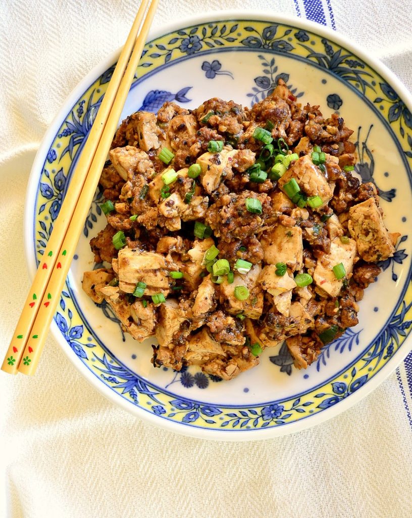 Ma Po Tofu is pure Chinese comfort food. Flavored with a bit of ground pork and garlic, and a bit of Szechuan peppercorns, the soft tofu contrasts well with the heat. I love it when it is made right! #tofu #Chinesefood #Szechuan www.thisishowicook.com Ma Po Tofu is pure Chinese comfort food. Flavored with a bit of ground pork and garlic, and a bit of Szechuan peppercorns, the soft tofu contrasts well with the heat. I love it when it is made right! #tofu #Chinesefood #Szechuan www.thisishowicook.com