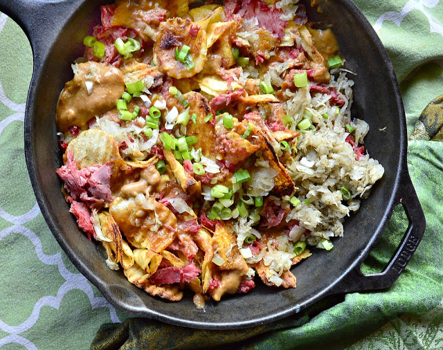 Irish nachos with corned beef and a beer cheese sauce, all on potato chips are addicting!