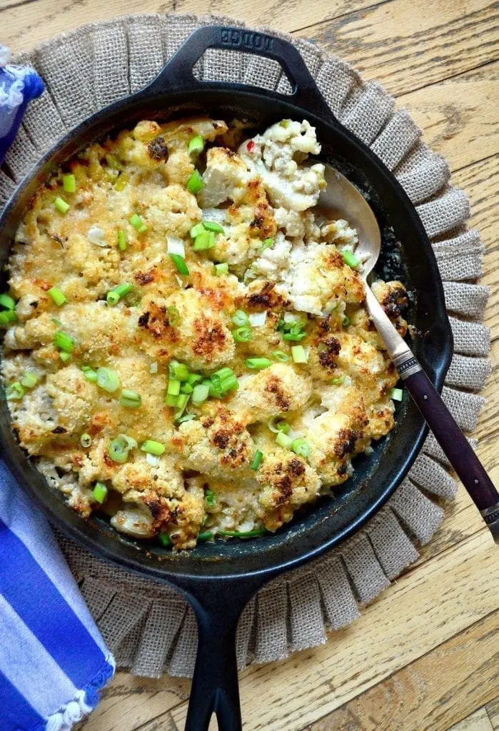 This Cauliflower Gratin Casserole has the right stuff. Made to be rich; this dish is filled with cheese and cream. Some might think of it as mac and cheese, except cauliflower replaces the mac. Reminds me of a steakhouse side dish-where often times you want the side dish more than the steak! www.thisishowicook.com #cauliflower #casserole