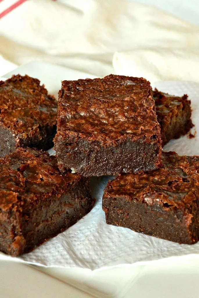 These over the top, no frosting necessary, decadent dark chocolate fudgy brownies are the perfect dessert. Unless of course you don't like dense dark chocolate morphed into fudgy brownies, in which case you should skip this post! #brownies #fudgebrownies #baking www.thisishowicook.com