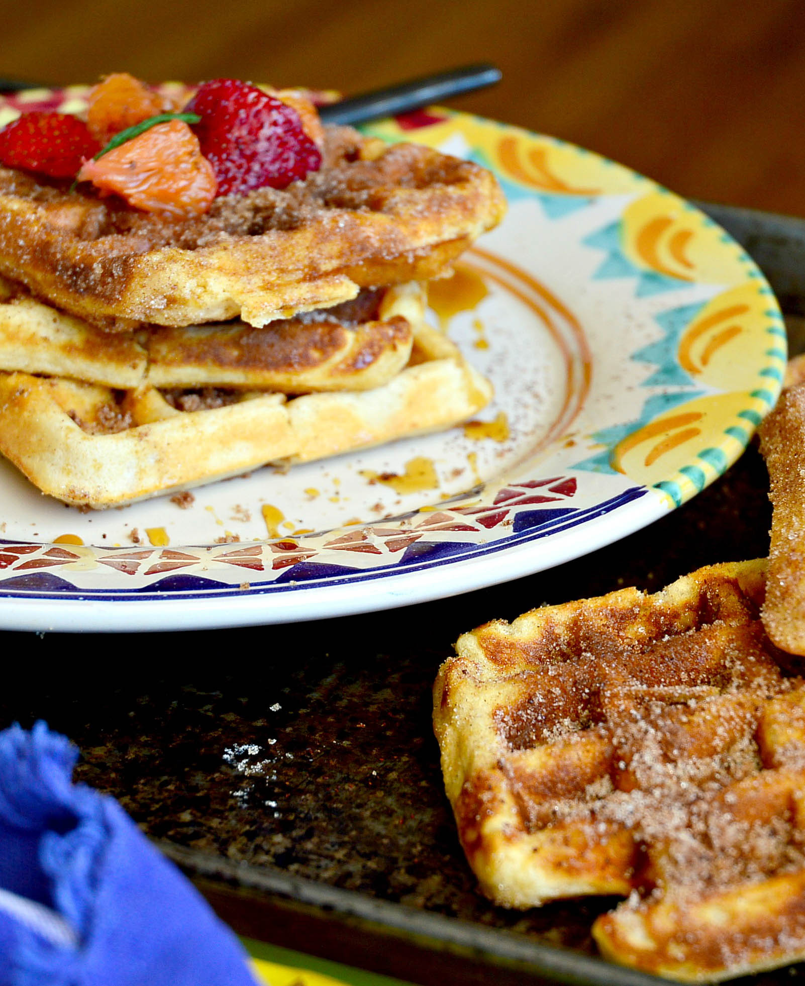 churro waffles stack on colorful plate