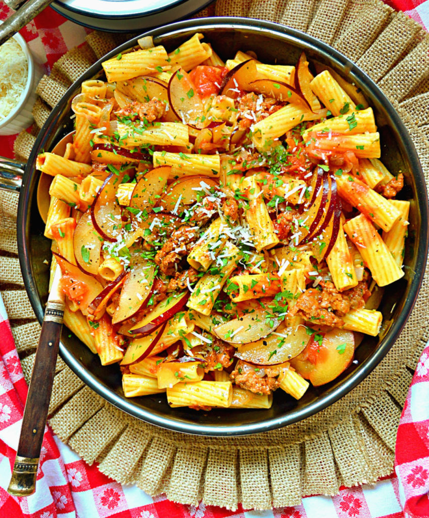 Sausage Rigatoni with plums in a skillet