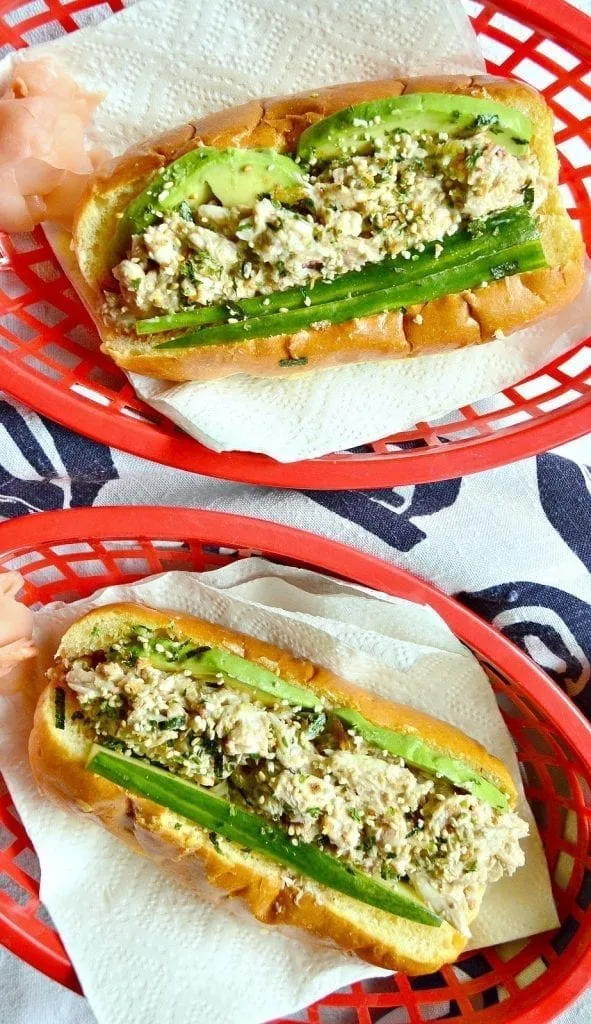 crab salad and avocado in a bun, red basket