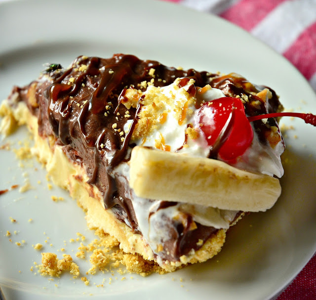 Pie with chocolate and banana, maraschino cherry