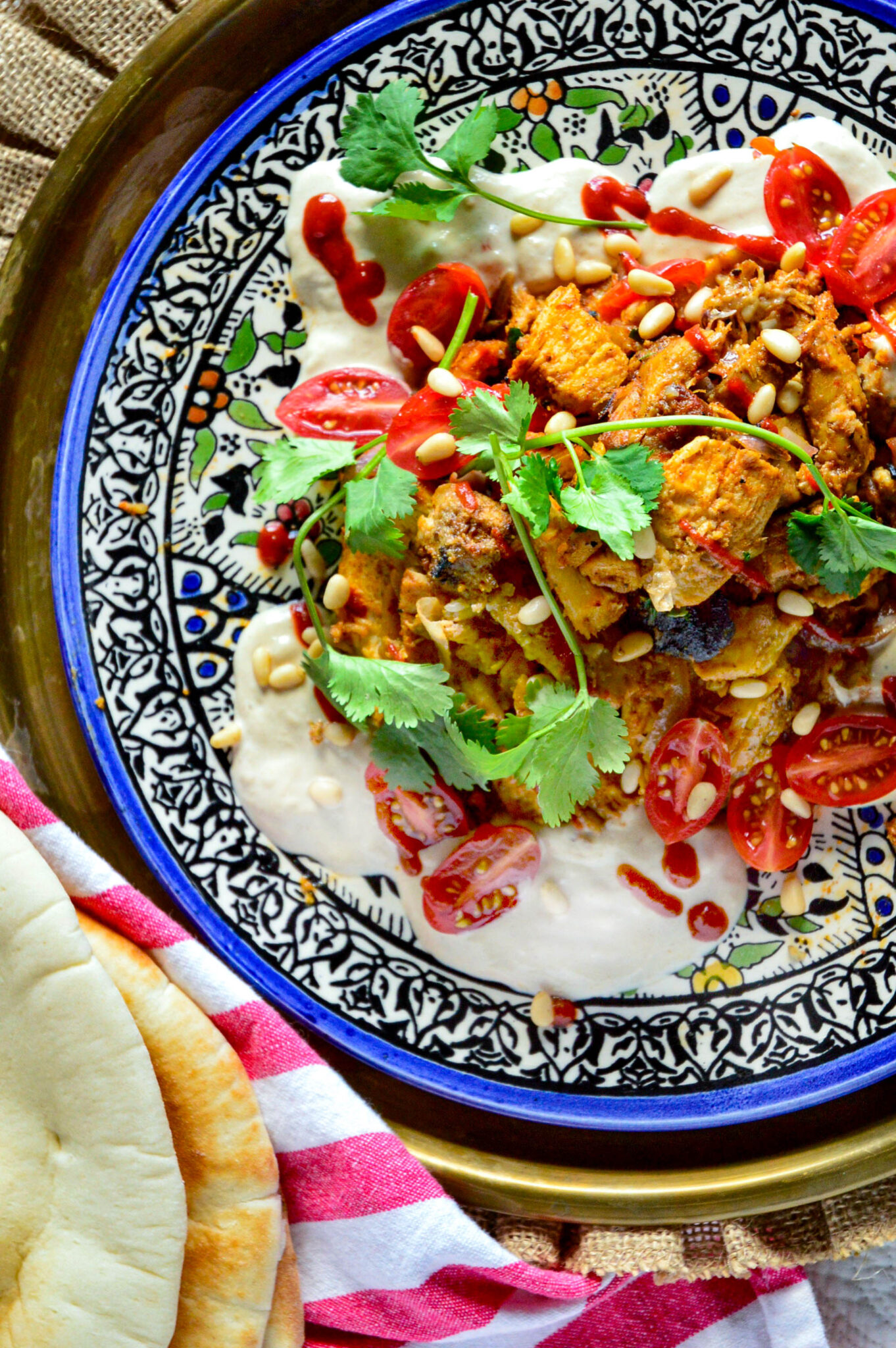 chicken shawarma recipe on decorative plate with pita