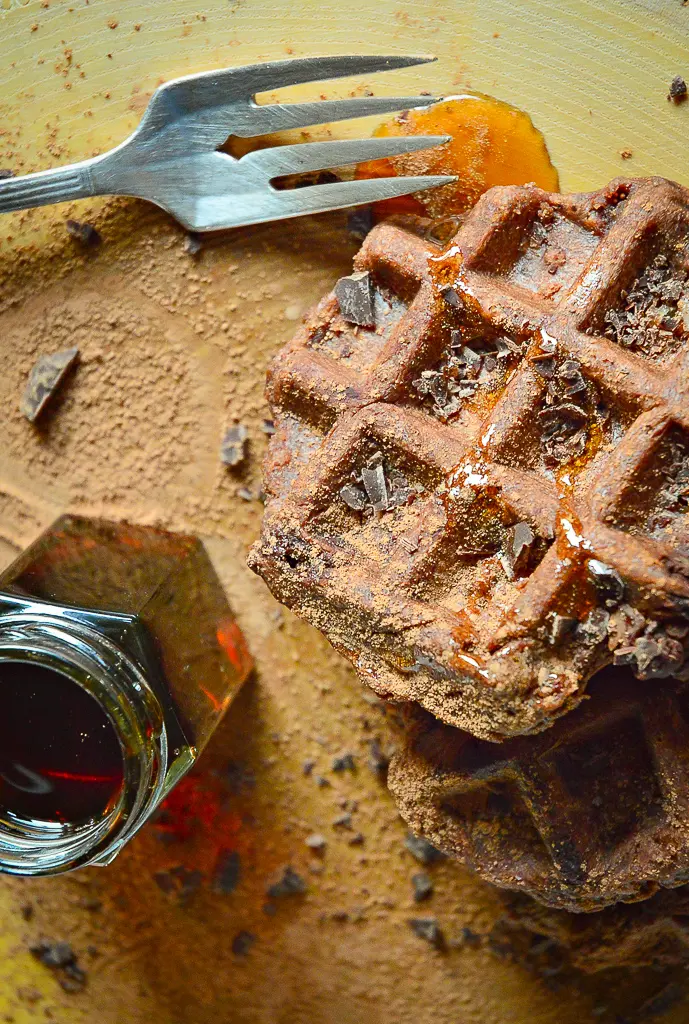 Chocolate Waffles with fork and syrup