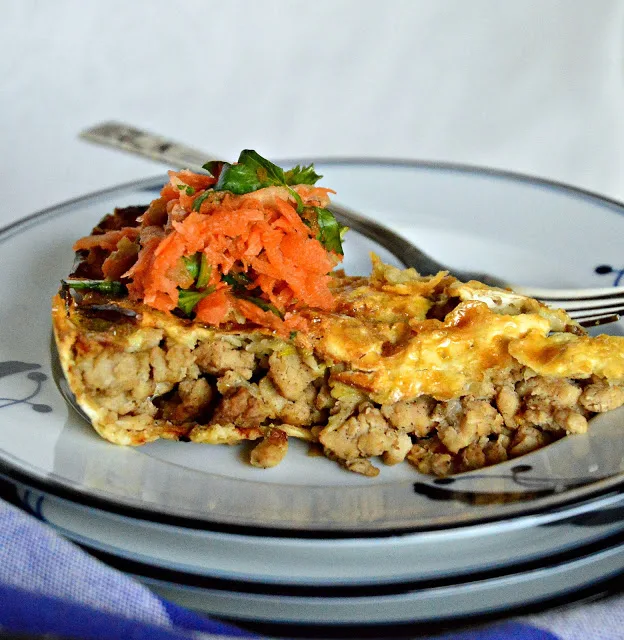 This cardamom coffee flavored ground chicken is cooked with onion and garlic and stuffed into a matzoh pie shell. Topped with a carrot salad this is a new way to do dinner! #matzoh #passoverrecipes #pie #cardamom www.thisishwicook.com