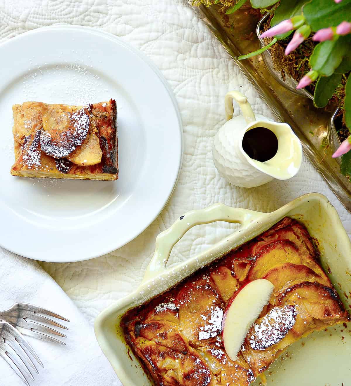 mato casserole with ssquare of matzo brei on white plate and caramel apple matzo casserole in baking dish