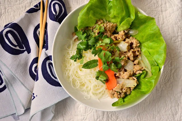 Vietnamese Chicken with Vinegar and Lemongrass is quickly stir fried and can be served over rice, in a bowl or with lettuce. This peppery, tangy garlic chicken is so good! #vietnamesefood #vietnameserecipes #vietnamesechicken #chicken www.thisishowicook.com
