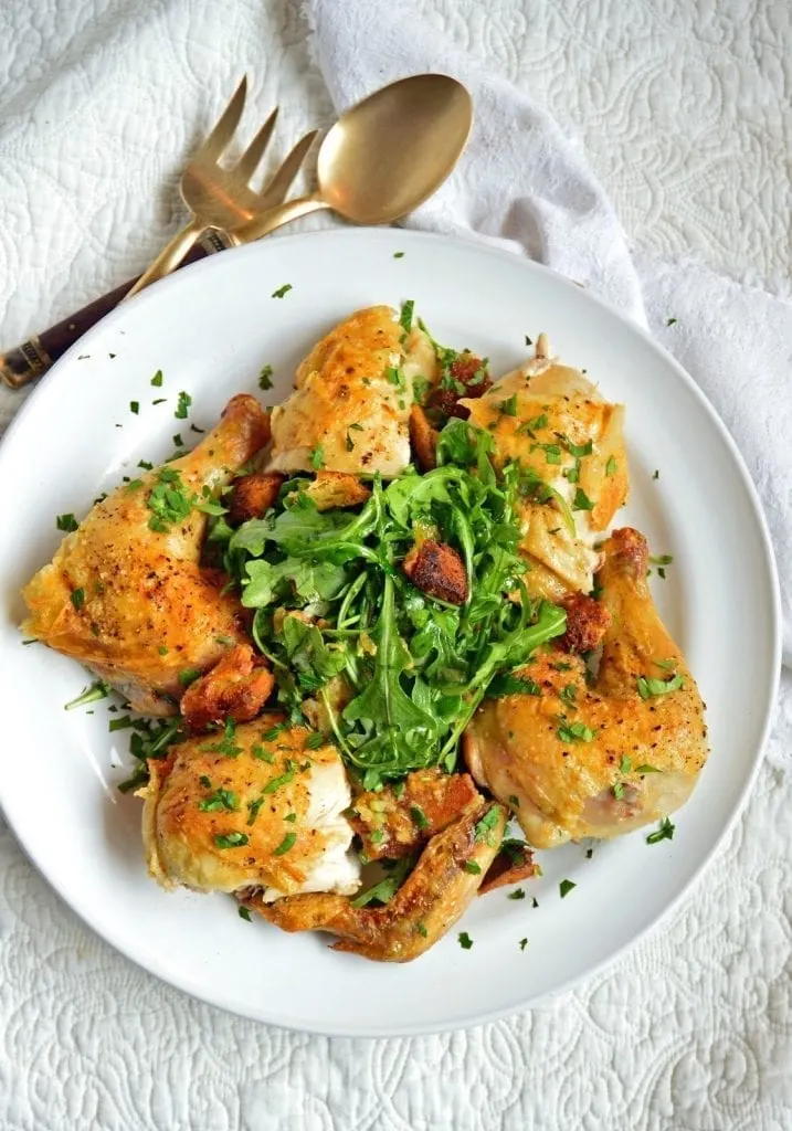  This crispy roast chicken with bread salad is simple and divine. Roasted over artisan bread cubes that become crispy while baking and then tossed with salad, this one dish meal is fabulous!