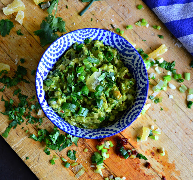 A great guacamole with dried pineapple, chipotle and tequila. Jazz up your avocados. You will love this new twist! #guacamole #dips #appetizers #MexicanFood www.thisishowicook.com