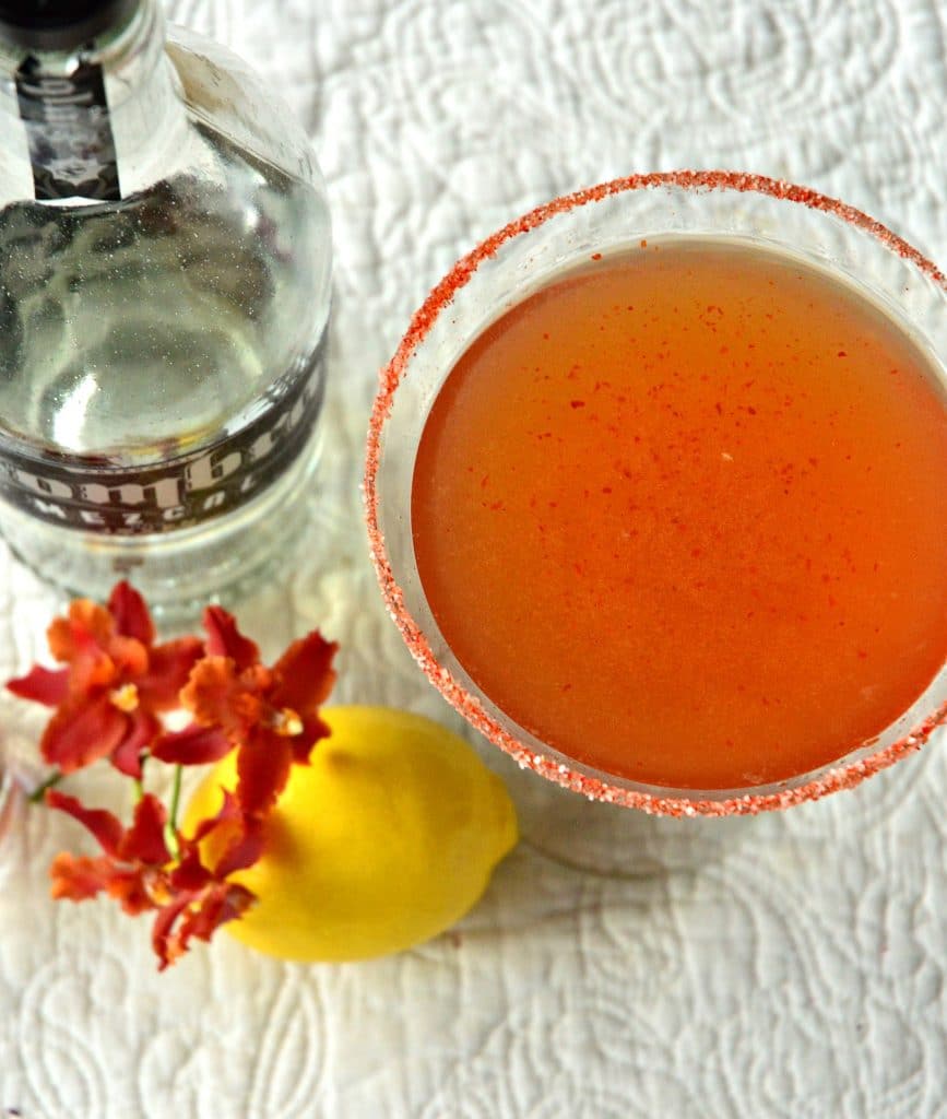 A Mezcal Spicy Mama is perfect for the end of the week. Made with smoky mezcal, Pama pomegranate liqueur, fresh lemon juice, agave and a kicker of spicy harissa or muddled jalapenos, this mezcal cocktail is sure to calm you down and rev you up! #mezcal #cocktails See more at This is How I Cook!