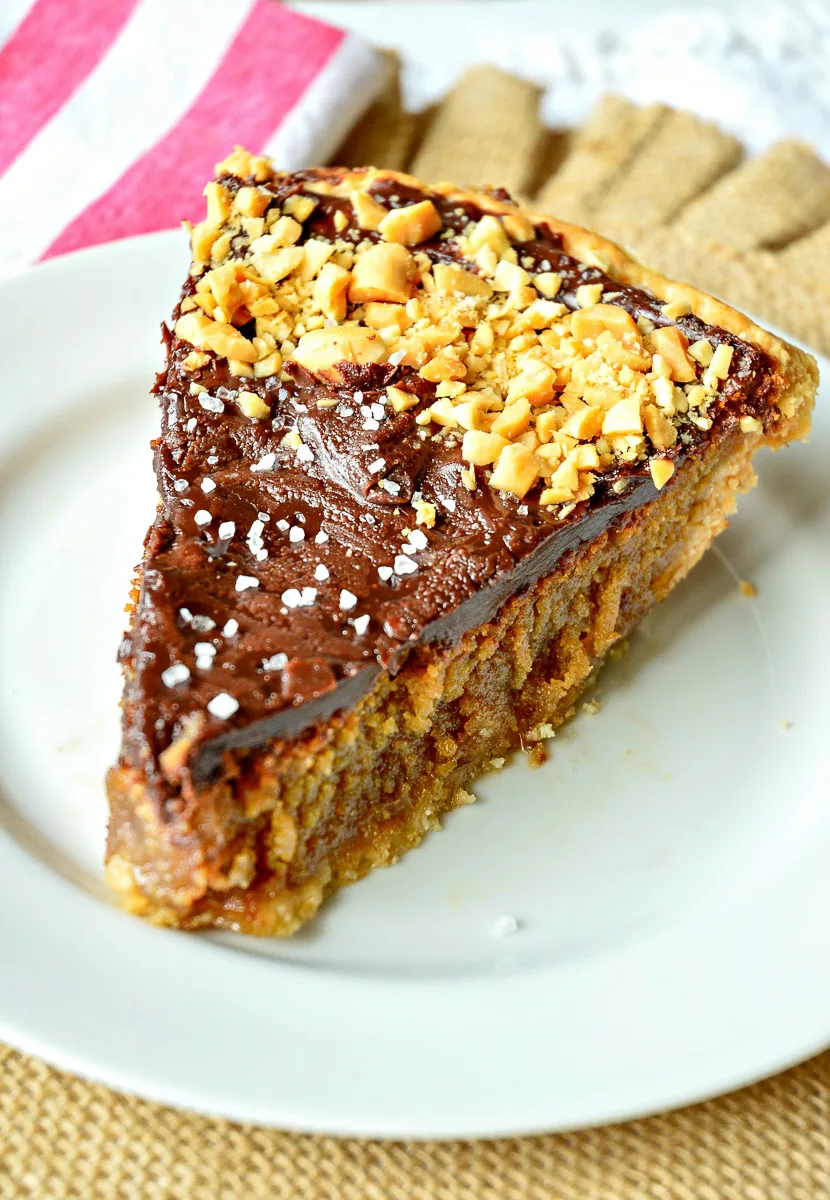 Slice of peanut butter pie with chocolate ganache