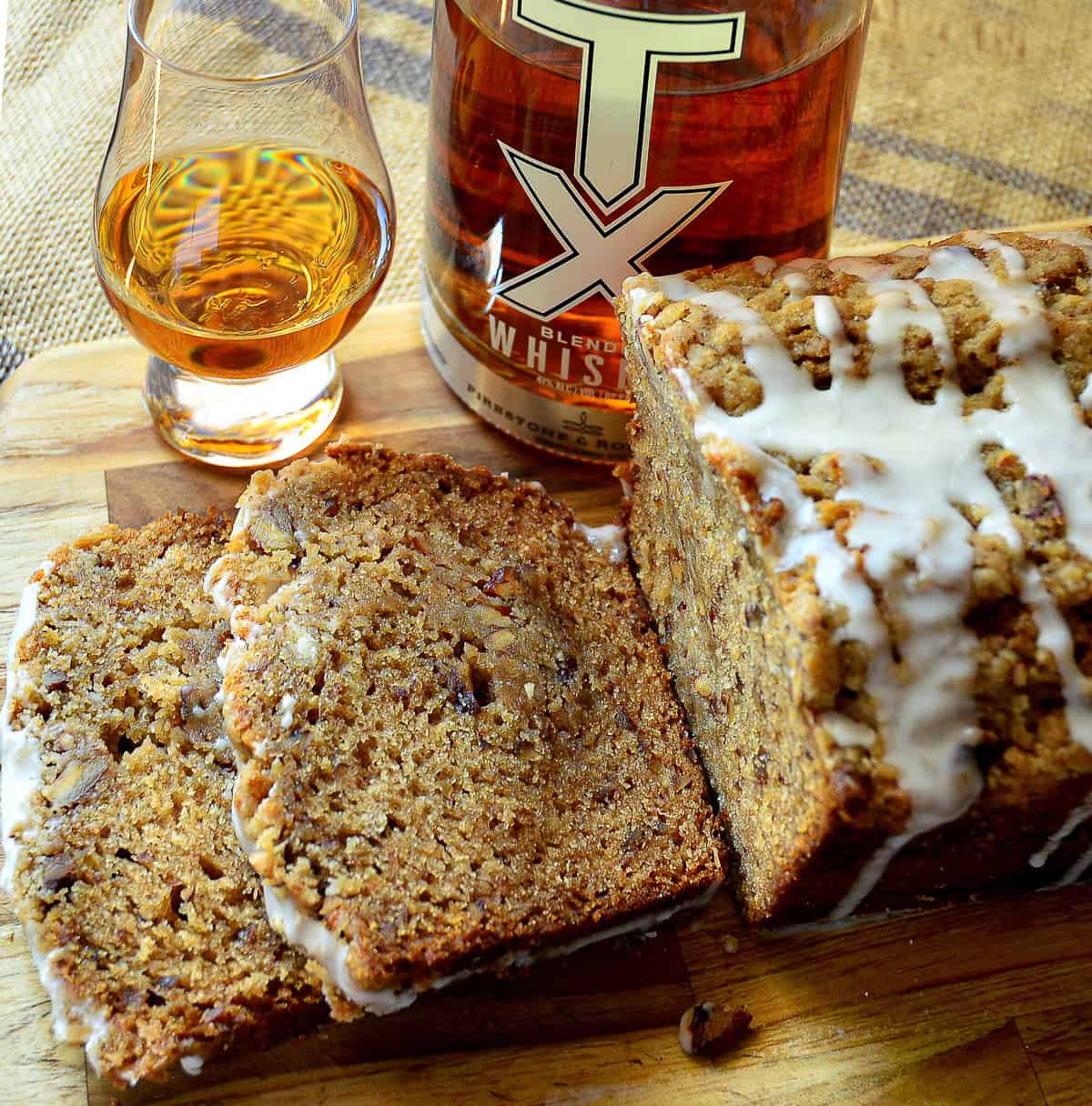 untraditional Jewish honey cake with glass of whiskey in background