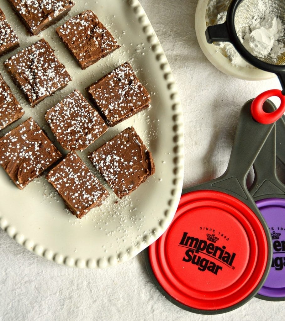 Big Batch Brownies on white platter with Imperial Sugar collapsible measuring cups