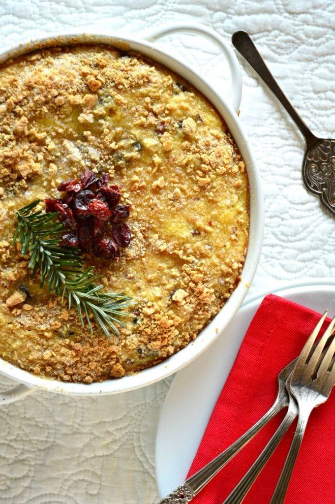 sweet breakfast grits cake in round white dish with red napkin