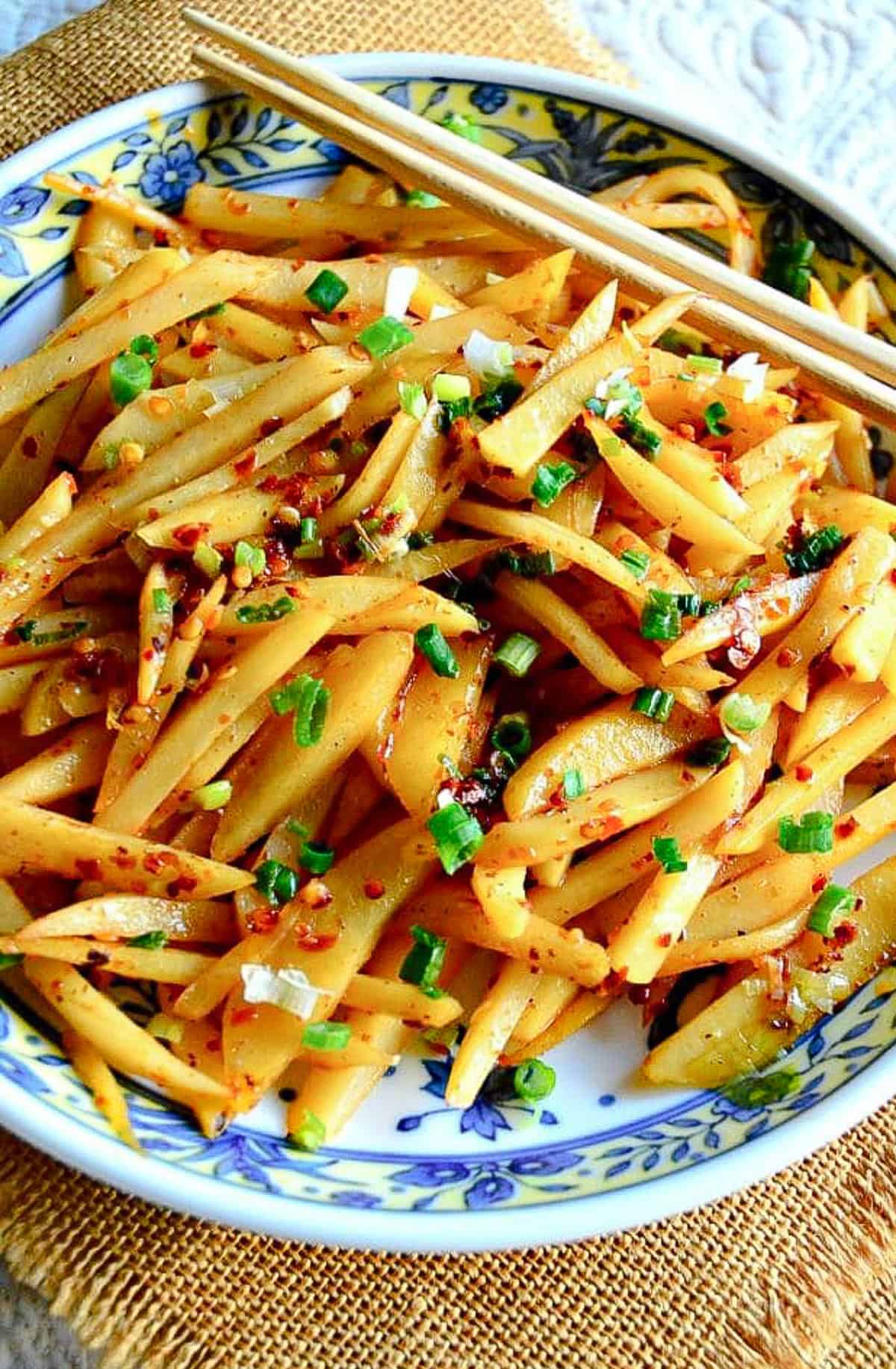 chinese stir fried potatoes in chinese bowl