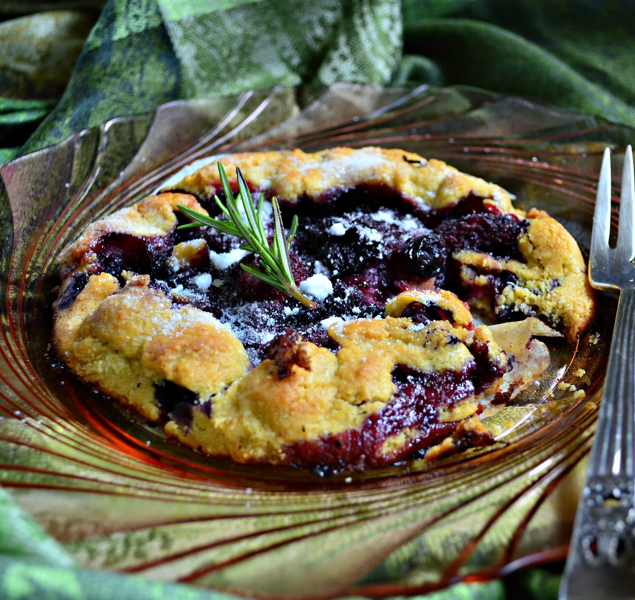 grilled fruit pie/clear plate/fork/green scarf