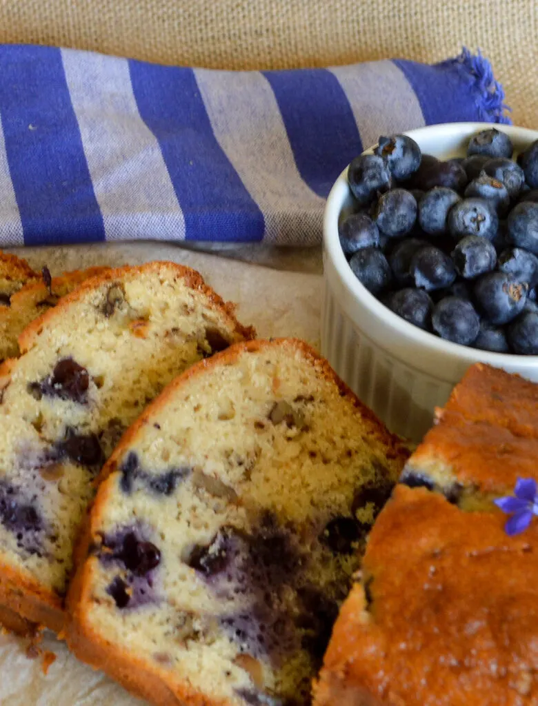 slices of blueberry bread recipe with blueberries
