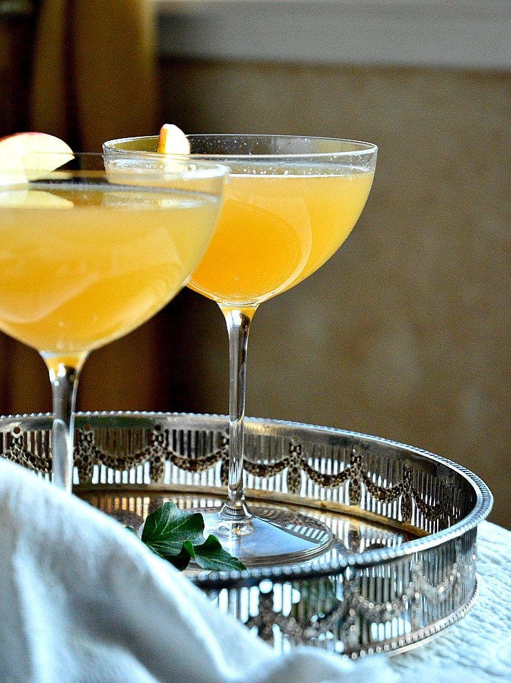 harvest ole mezcal cocktail in coupe glass on silver tray