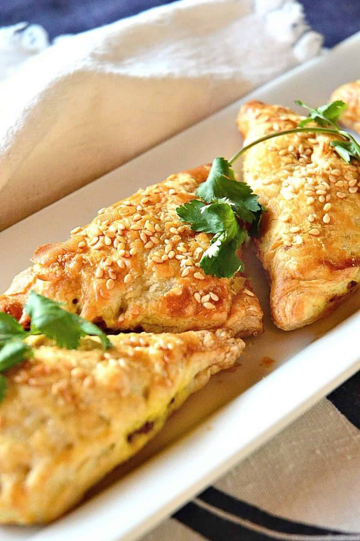 dim sum chicken curry on white plate with blue and white napkin