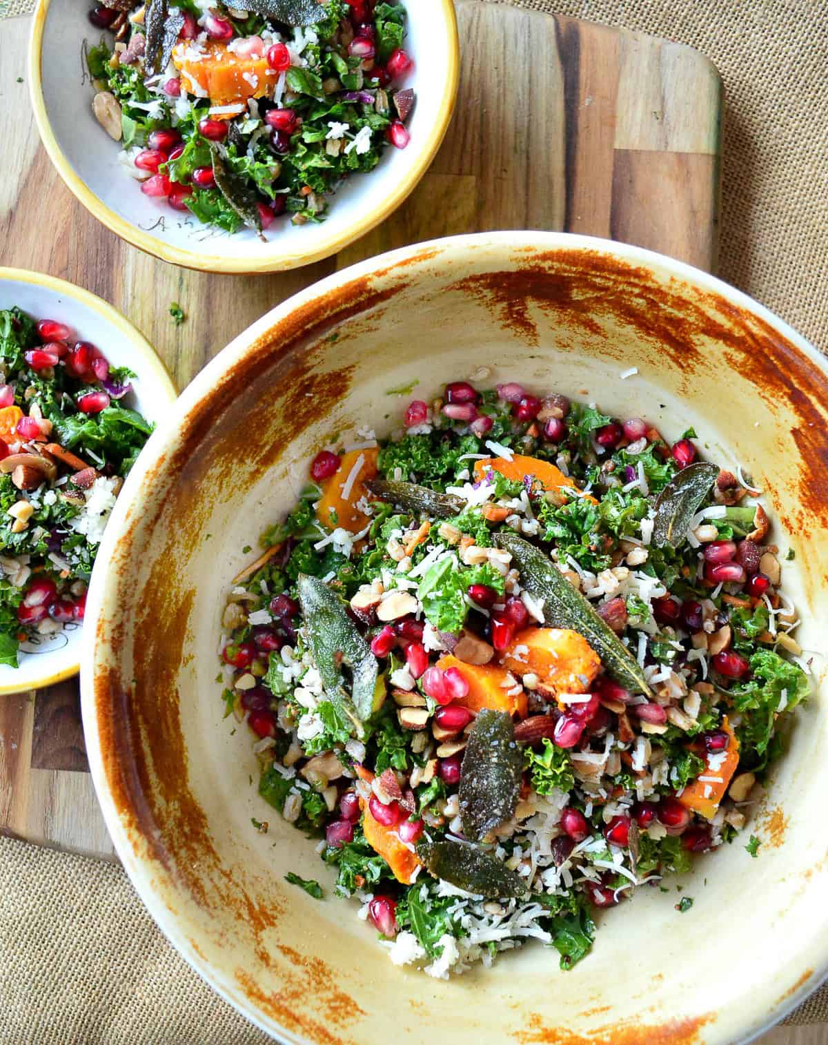 farro and kale salad with brown butter vinaigrette in rustic bowl