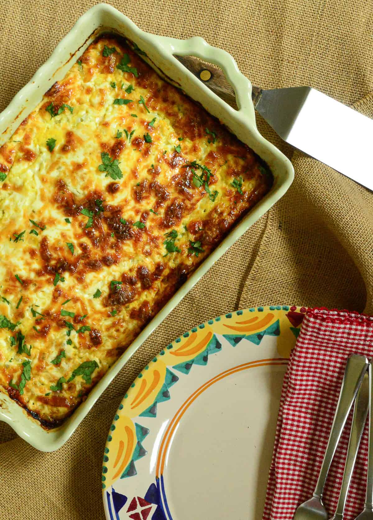 Mexican Breakfast casserole in green ceramic baking dish