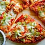 triangle of boboli pizza on cuttin board
